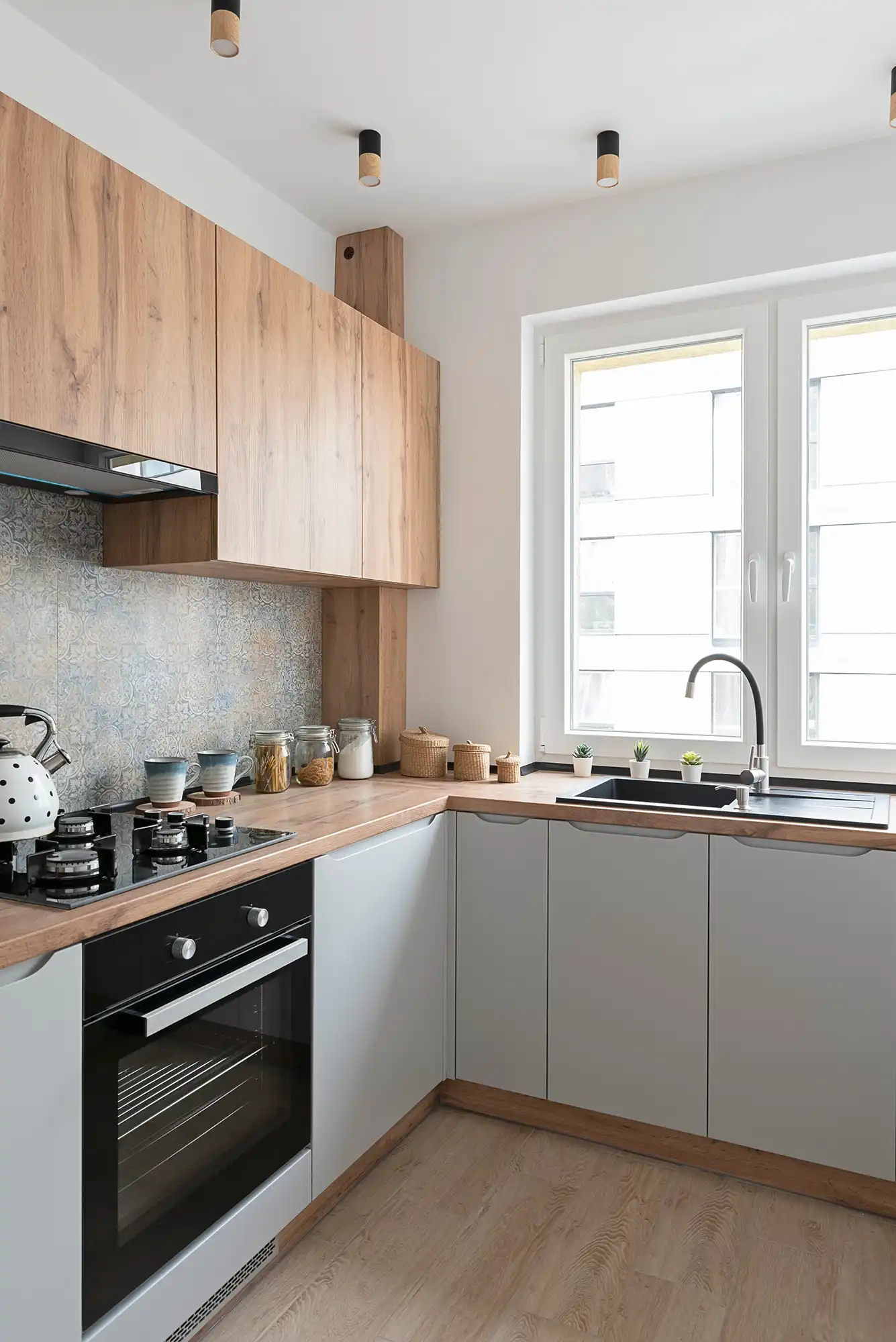 kitchen with green cupboards and wooden floor